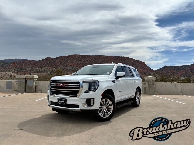 2024 GMC Yukon SLT in Summit White — front three-quarter view