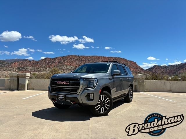2022 GMC Yukon AT4 in Satin Steel Metallic — front three-quarter view