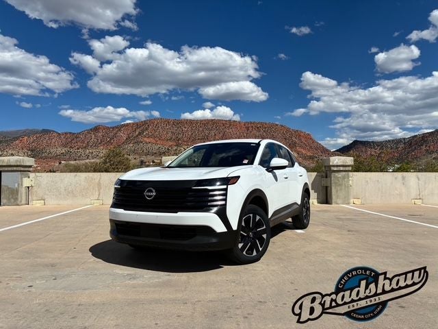 2025 Nissan Kicks SV in Fresh Powder — front three-quarter view